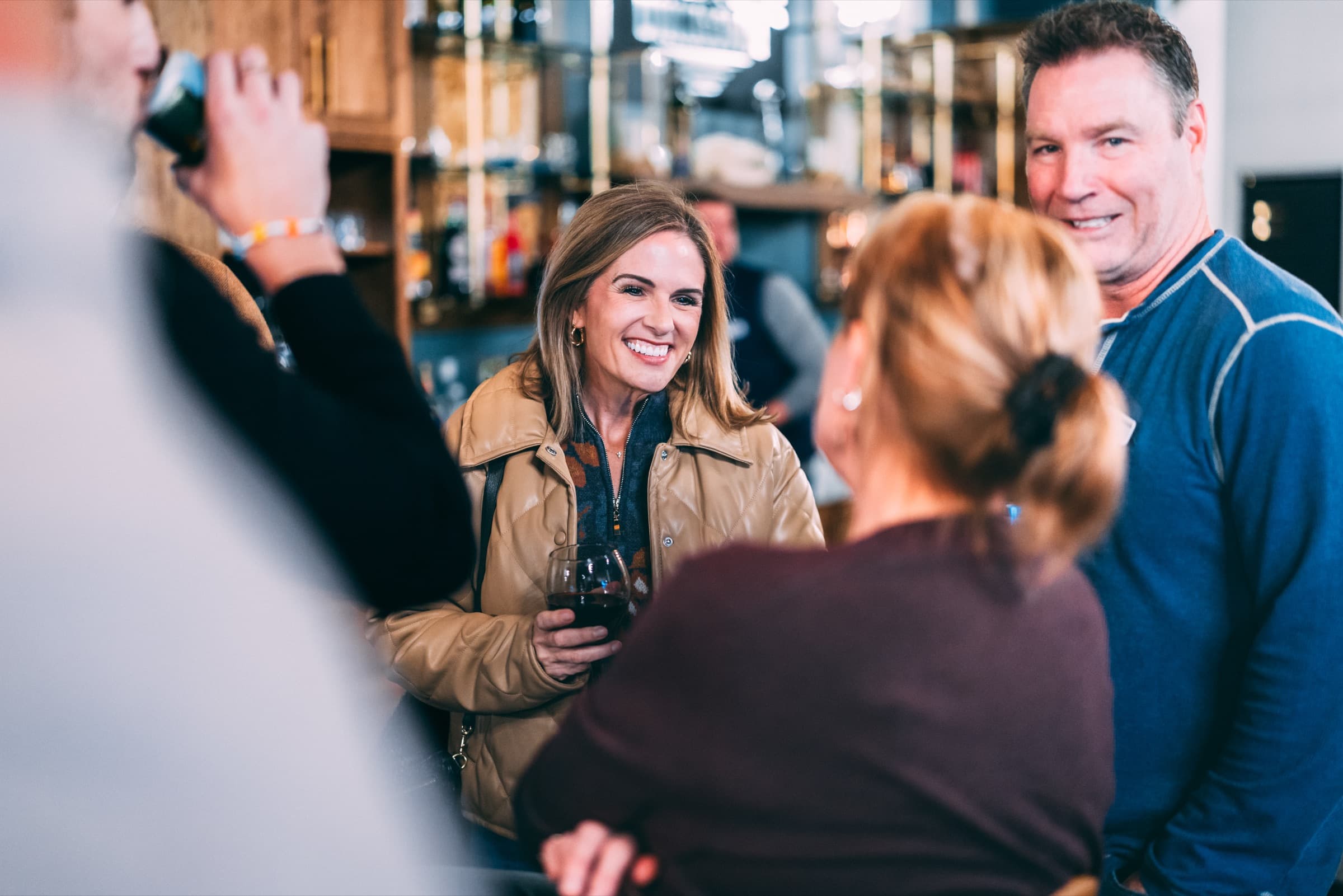 Members smiling and talking during a real clubhouse event